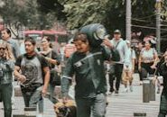 pexels-photo-27174507 This <a href="https://www.pexels.com/photo/a-man-carrying-a-dog-on-a-leash-in-a-busy-city-street-27174507/">Photo</a> was taken by <a href="https://www.pexels.com/@ezkol-arnak-221099453">Ezkol Arnak</a> on Pexels.