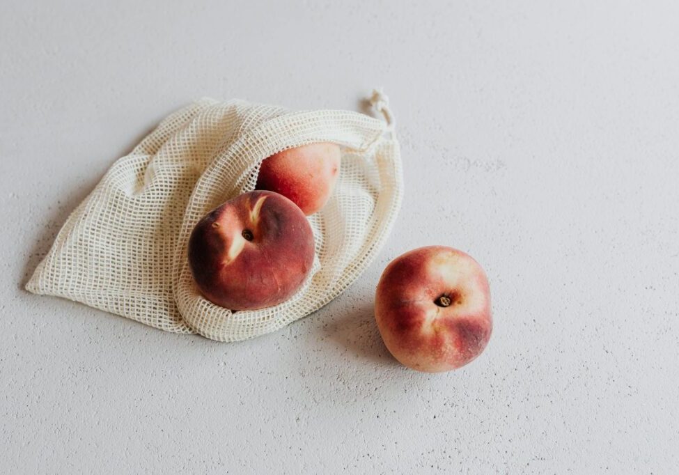 red apples inside the reusable bag