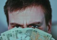 pexels-photo-6832333 This <a href="https://www.pexels.com/photo/serious-young-male-covering-face-with-banknotes-6832333/">Photo</a> was taken by <a href="https://www.pexels.com/@didsss">Diana ✨</a> on Pexels.